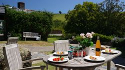 Ducks Nest table outside looking across the garden