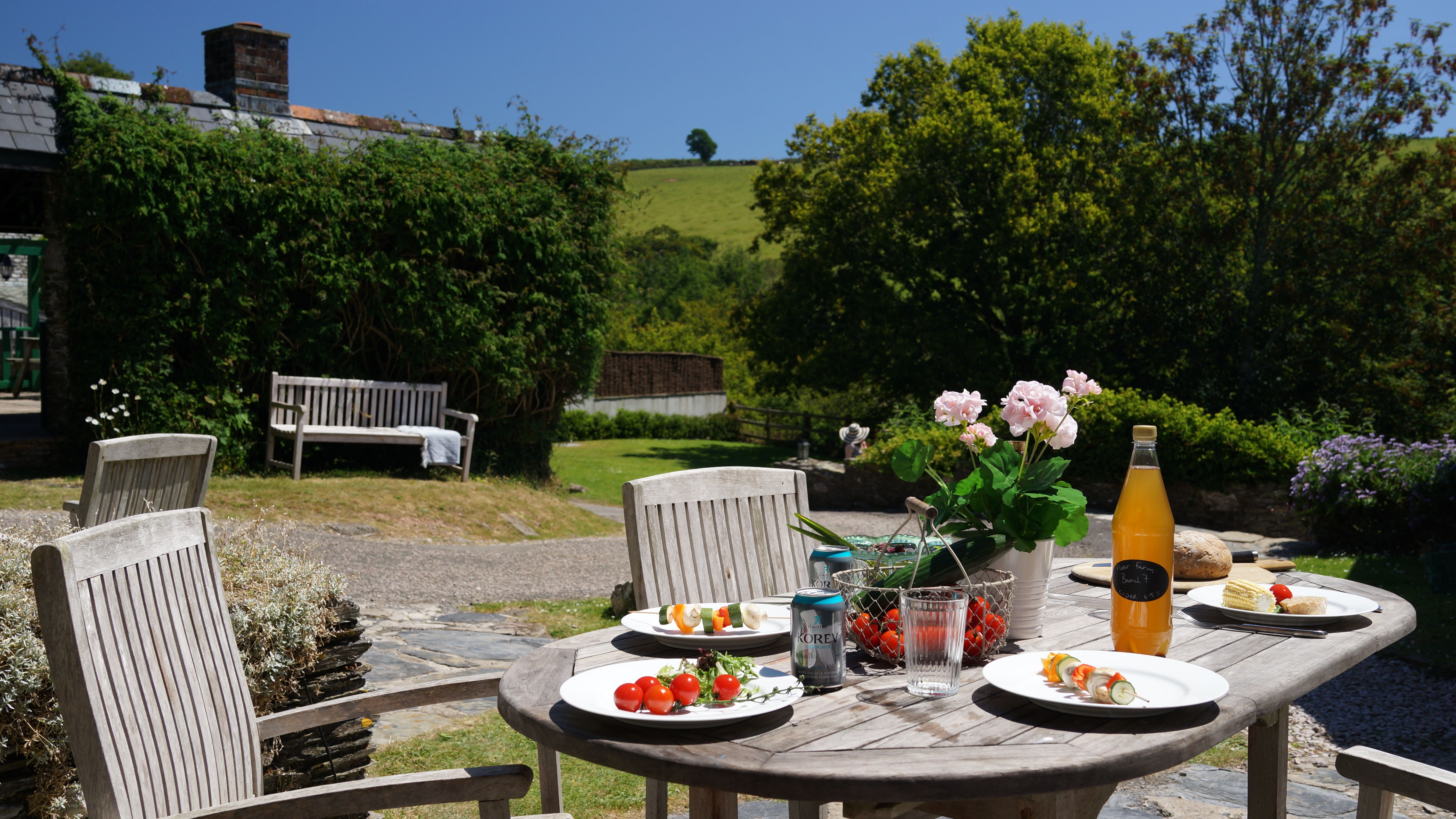 Ducks Nest table outside looking across the garden