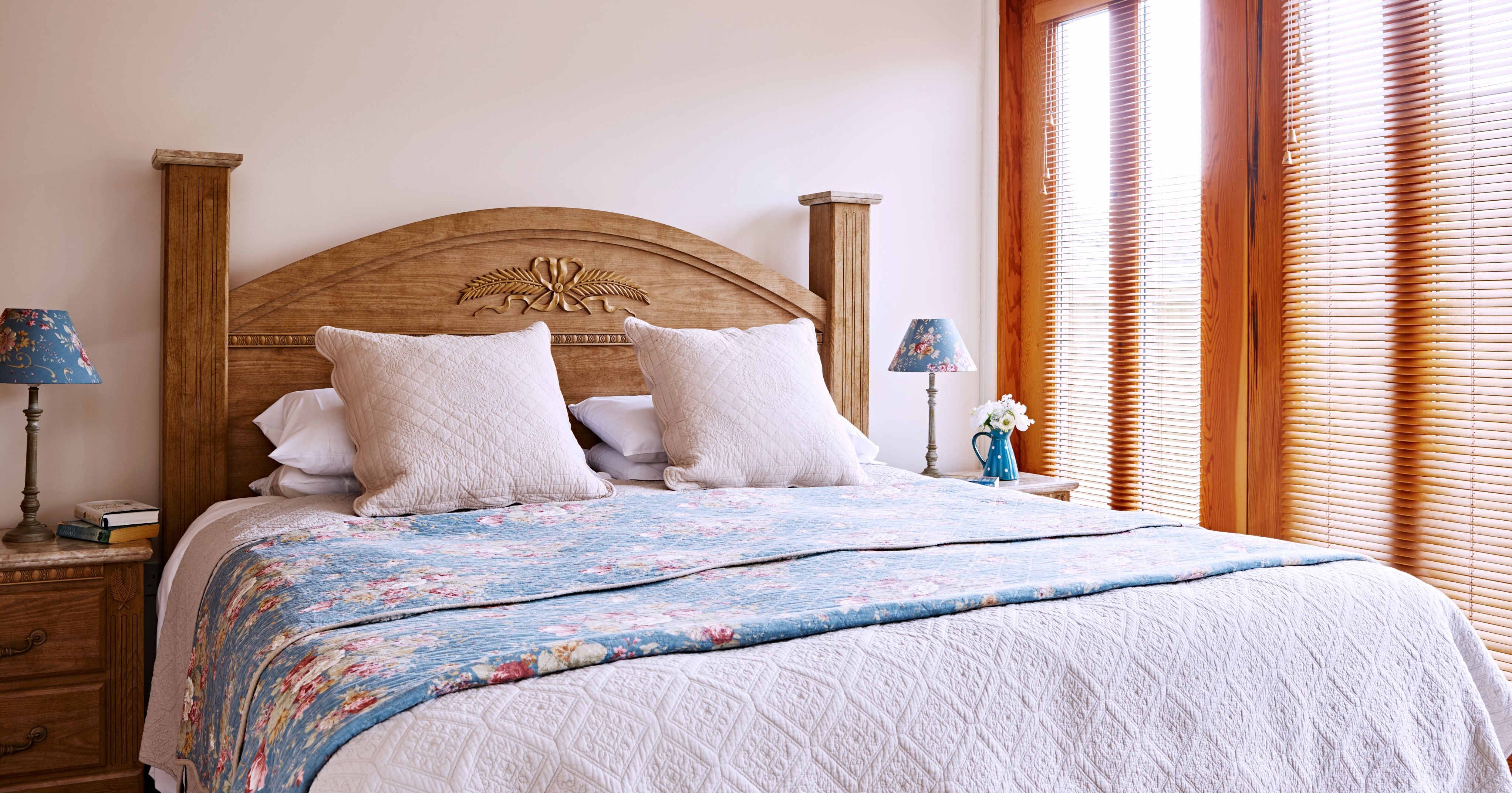 Ordhard bedroom with beautiful ornate carved headboard