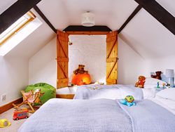 twin room with toys in the room