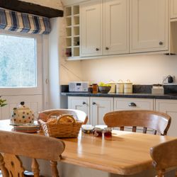 the stables dining table and kitchen