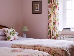 Pink twin bedded room