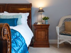 Traditional double bed with blue cover