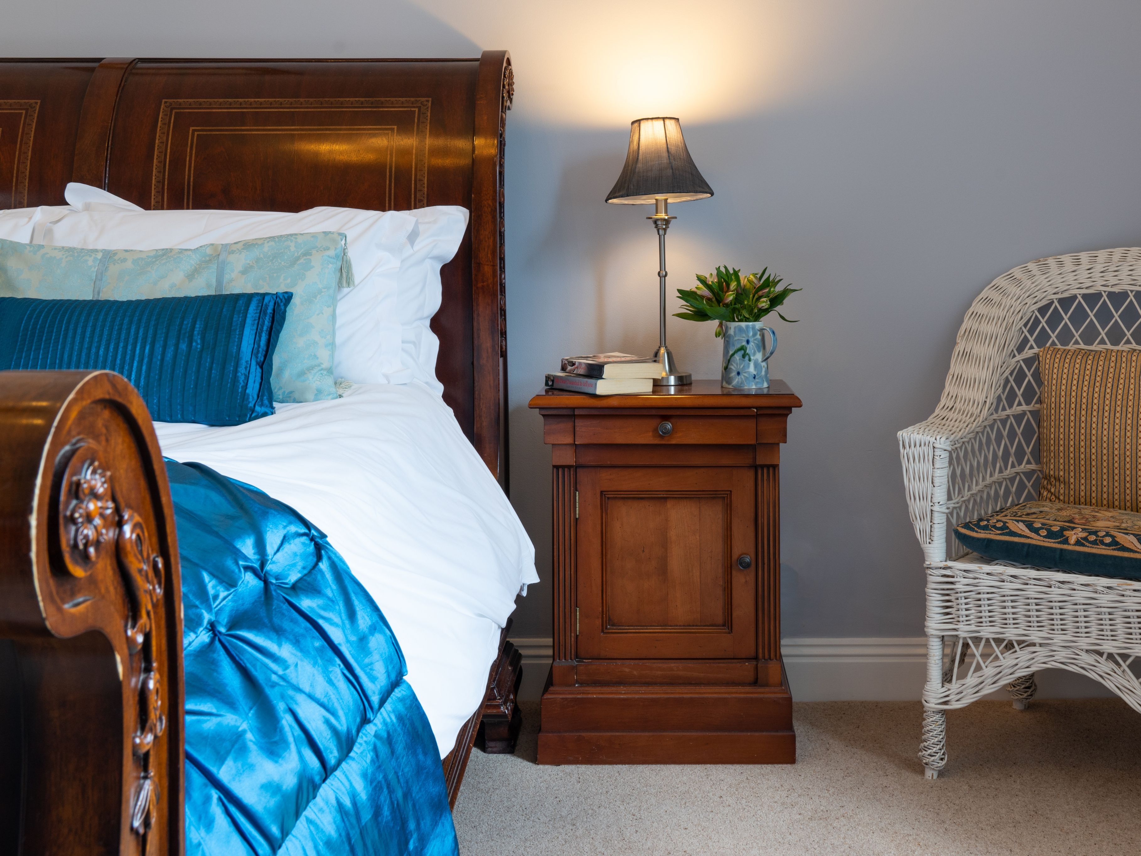 Traditional double bed with blue cover