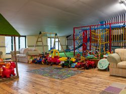 indoor play barn with climbing frame and push cars
