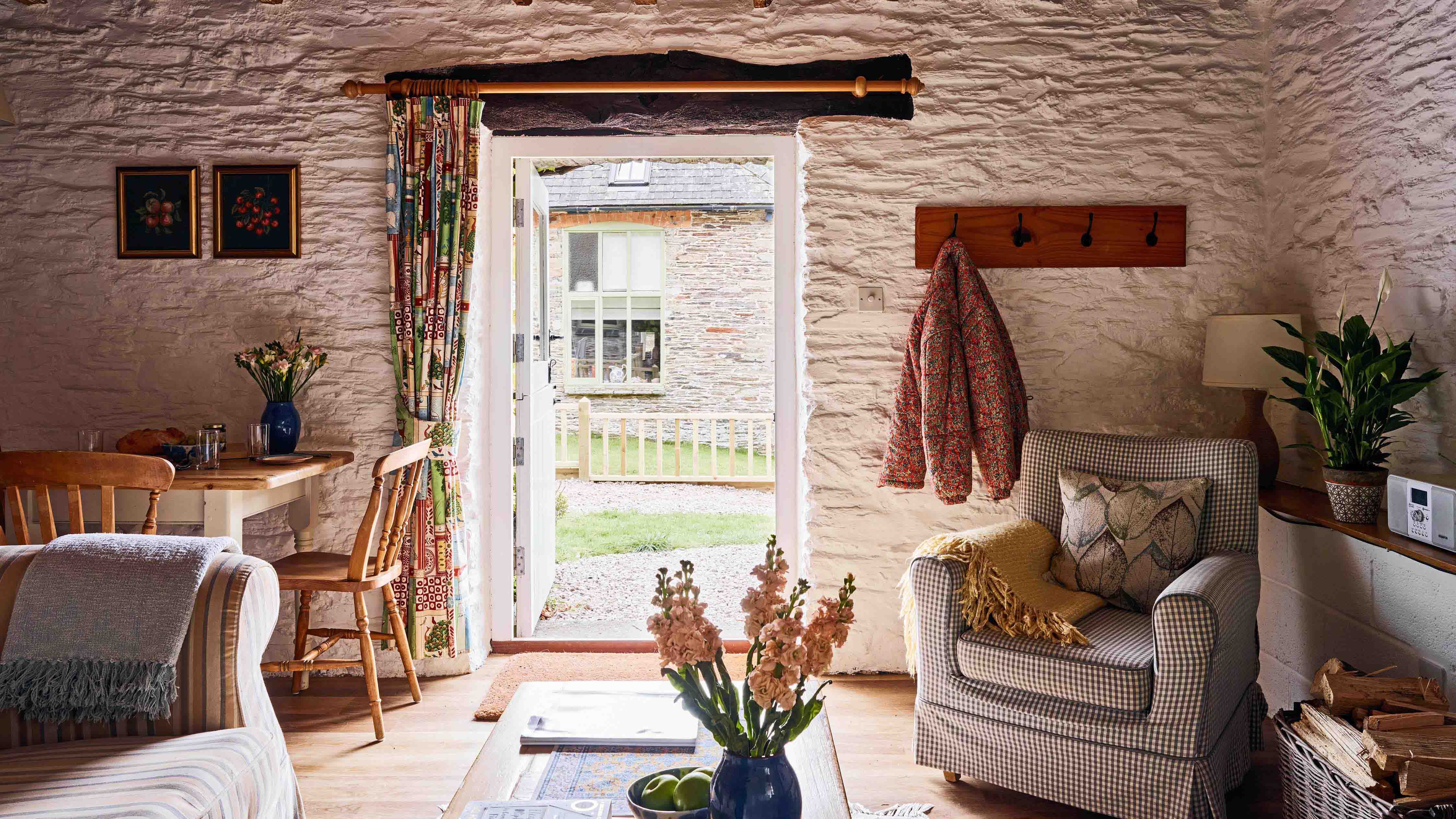 A view through the living room to outside the front of 1843 at Flear Farm Cottages