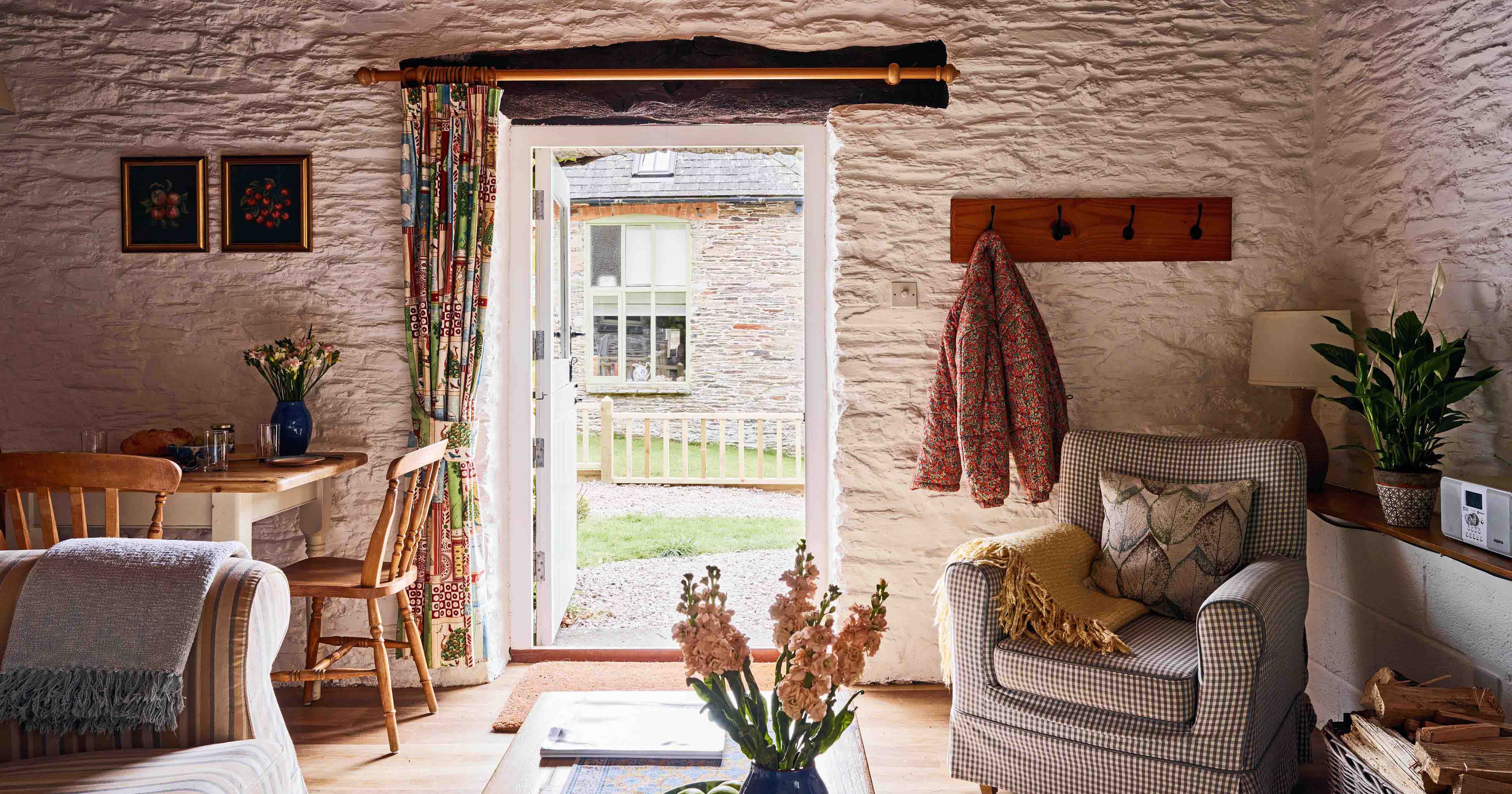 A view through the living room to outside the front of 1843 at Flear Farm Cottages