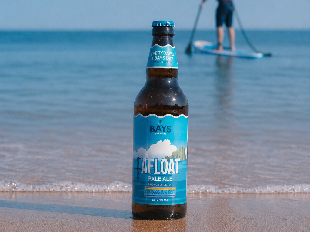 beer bottle on sandy beach Afloat brand from bays brewery