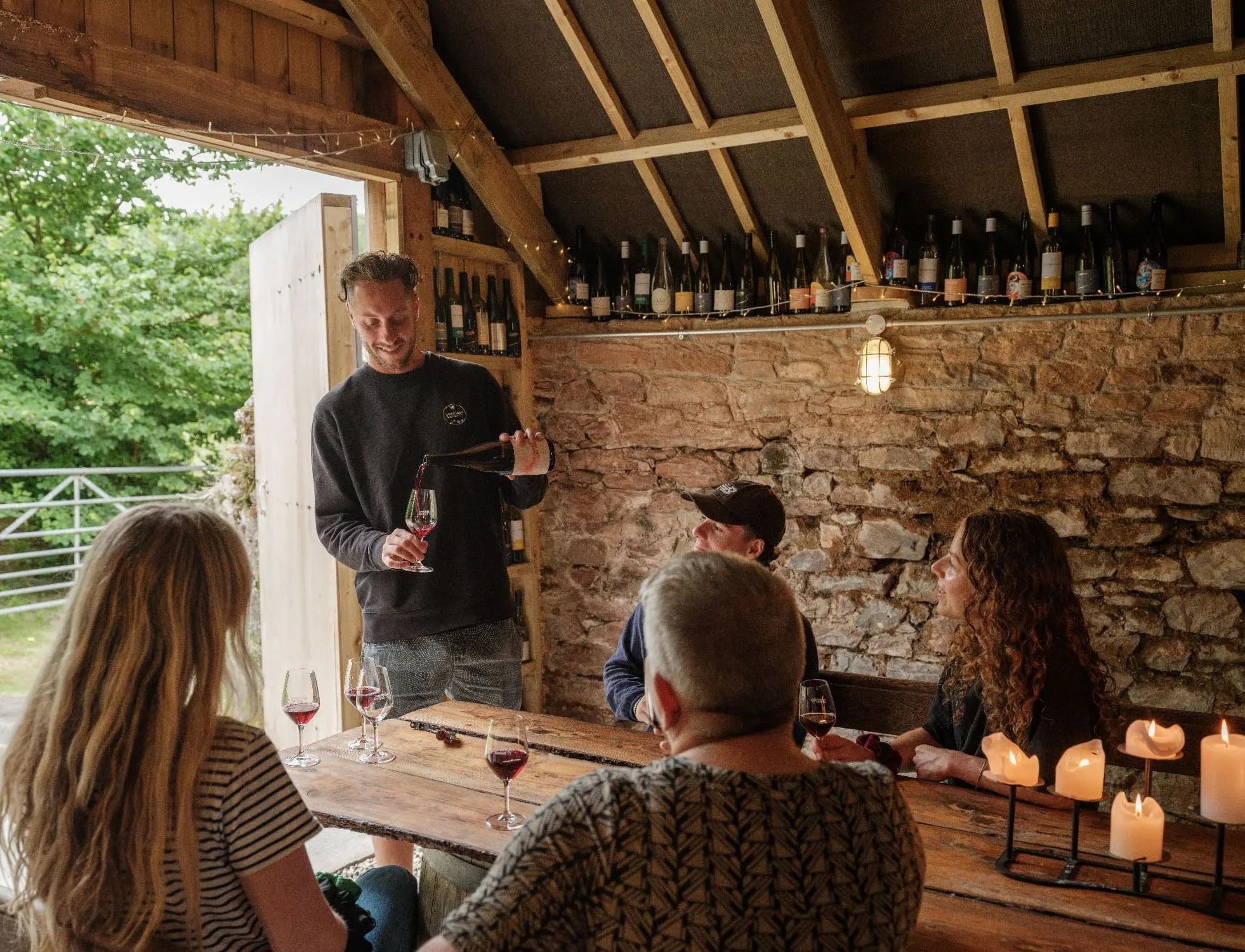 Sandridge Barton Guided Tasting Tom pouring wine with a small group