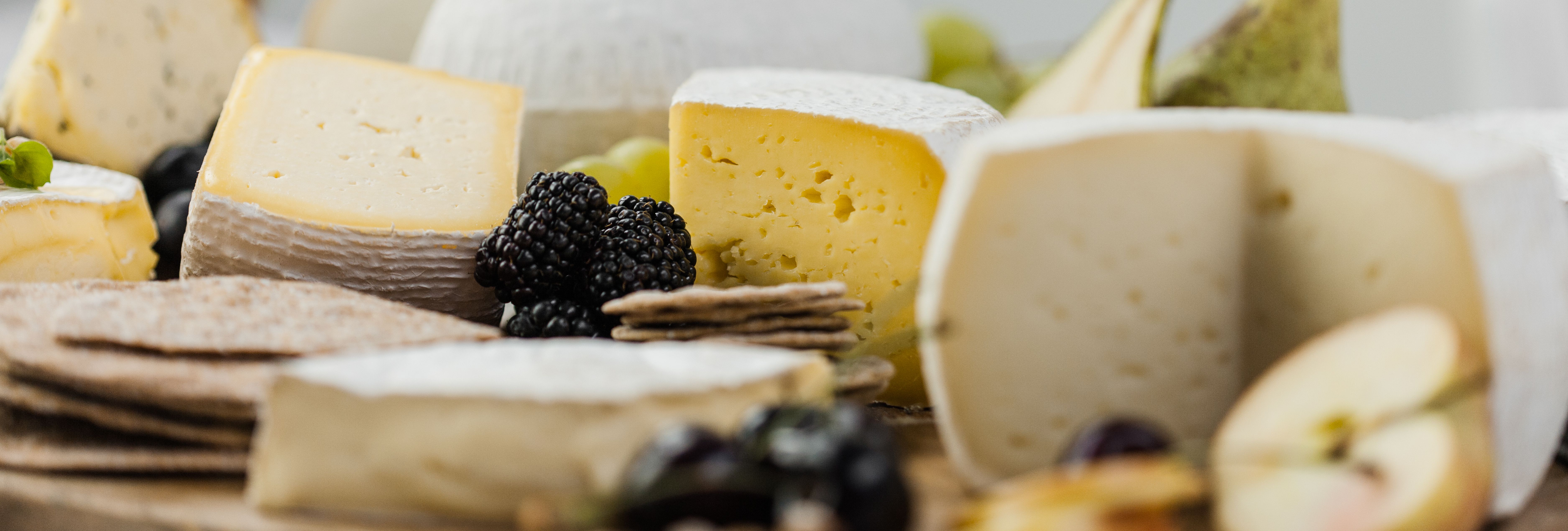 Sharpham Cheese board with fruit, wine and crackers