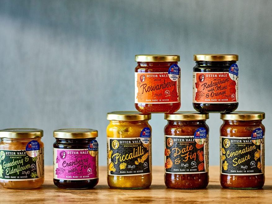 Selection of Otter Vale preserves and condiments in glass jars on a wooden surface
