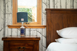 Harris tweed lamp on bedside table