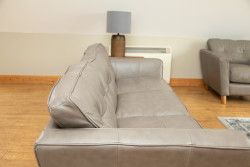 Grey sofa with lamp on table