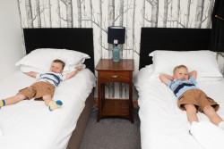 Two boys on twin beds