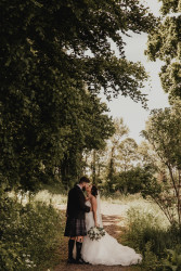Bride and groom in woods