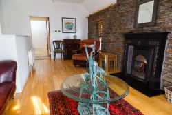 Glass table and fireplace in boathouse living room