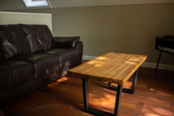Light reflecting on table in Glen Esk living room