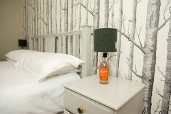 Harris Tweed lamp on bedside table