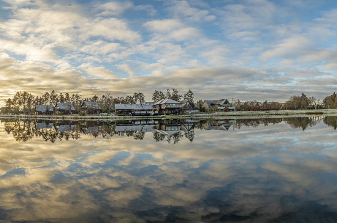 Cloud reflections on fishing pond