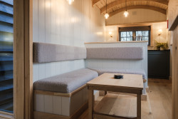 Kitchen and seating in shepherds hut