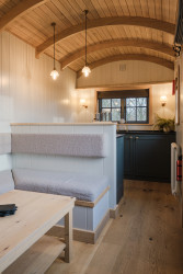Kitchen and seating in shepherds hut