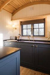 Kitchen and seating in shepherds hut