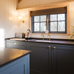 Kitchen and seating in shepherds hut