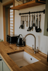 Cooking utensils above sink