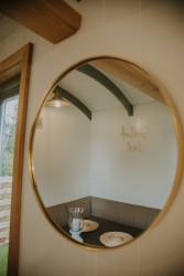 Mirror on wall in shepherds hut