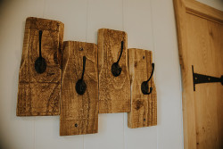 Coat hooks on wall in shepherds hut