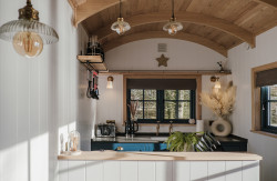 Kitchen and seating area in shepherds hut