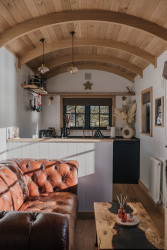 Kitchen and seating area in shepherds hut