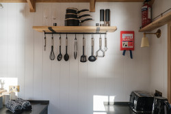 Utensils hanging on wall in kitchen area