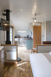 Seating area with log burner in The Burrow