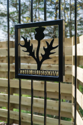 The Burrow sign on gate