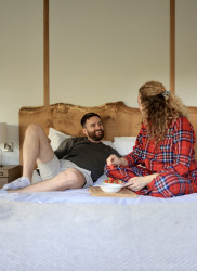 Couple on bed in Bankside Bothy