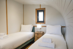 Twin beds in Bankside Bothy