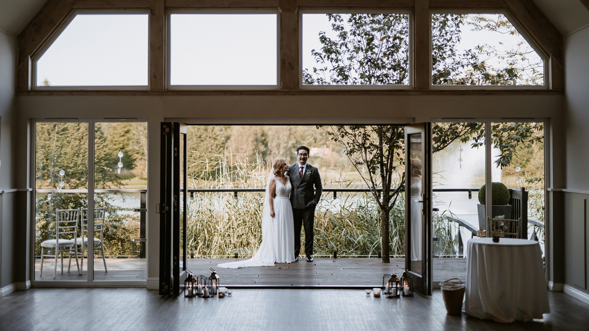 Bride and groom on decking of Buddon burn suite