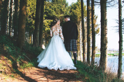 Bride and groom in woods