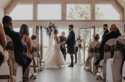 Bride and groom saying vows in Buddon Burn suite