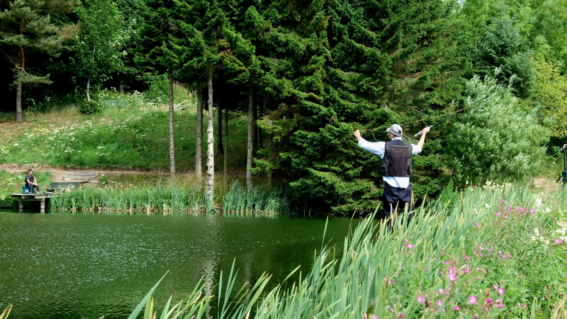 People fishing in fishing pond