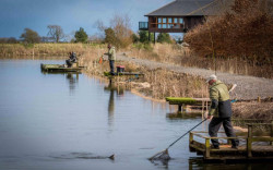 People fishing in fishing pond