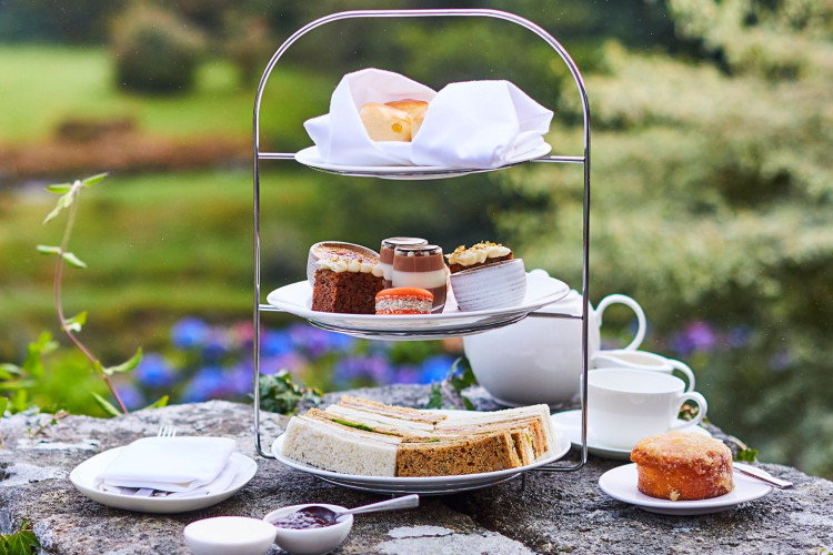 Afternoon tea outside with view of gardens