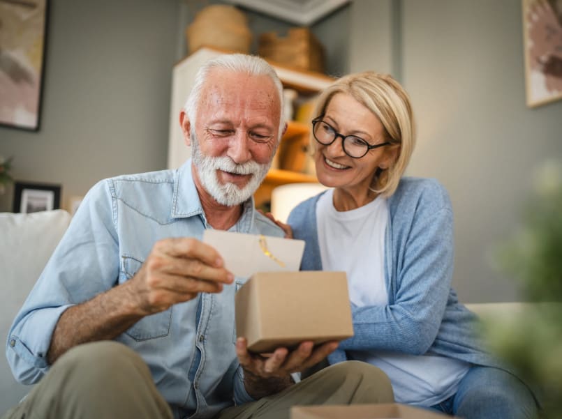 Wife giving her husband a gift