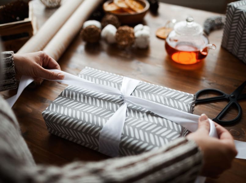 Someone wrapping gift