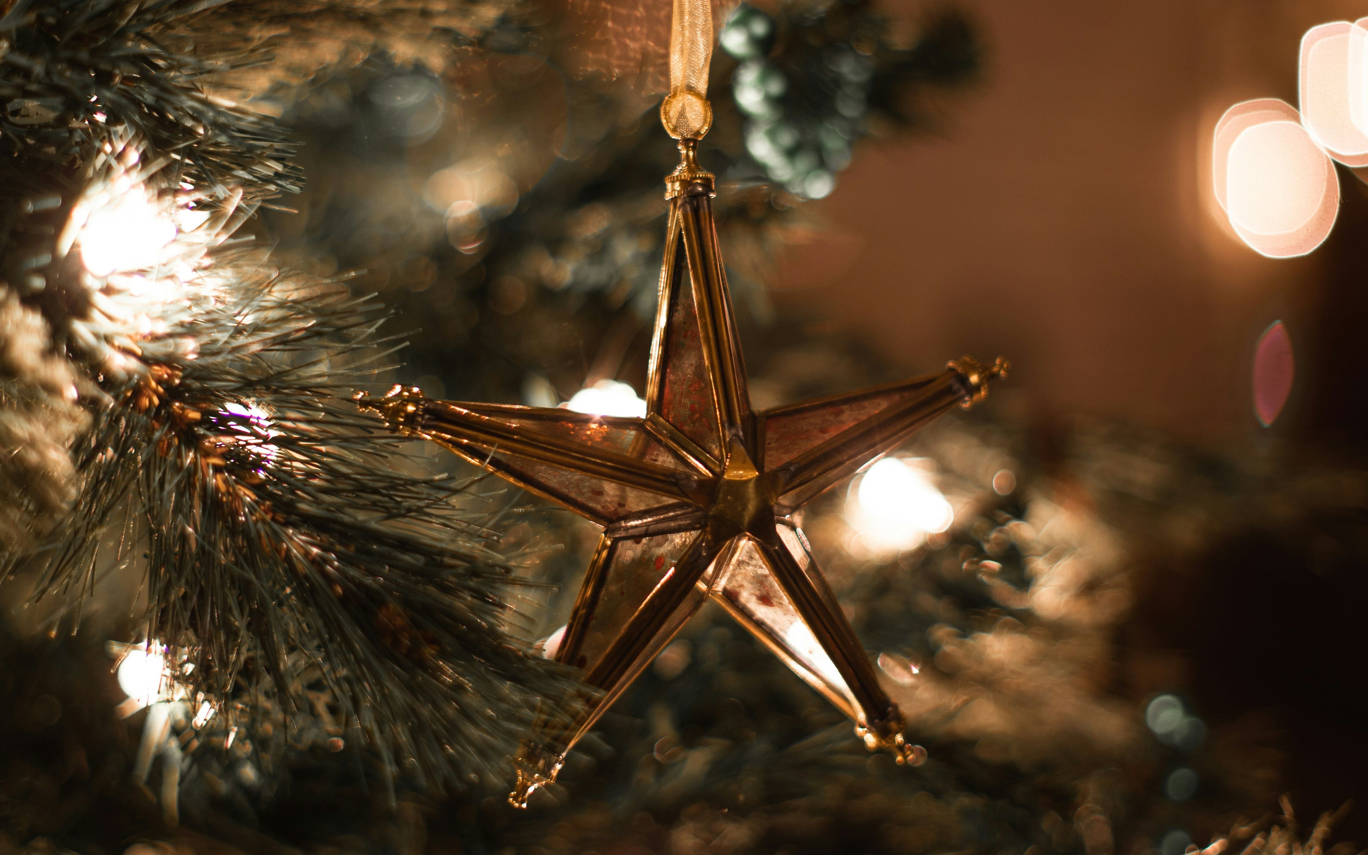 Star hanging on Christmas tree