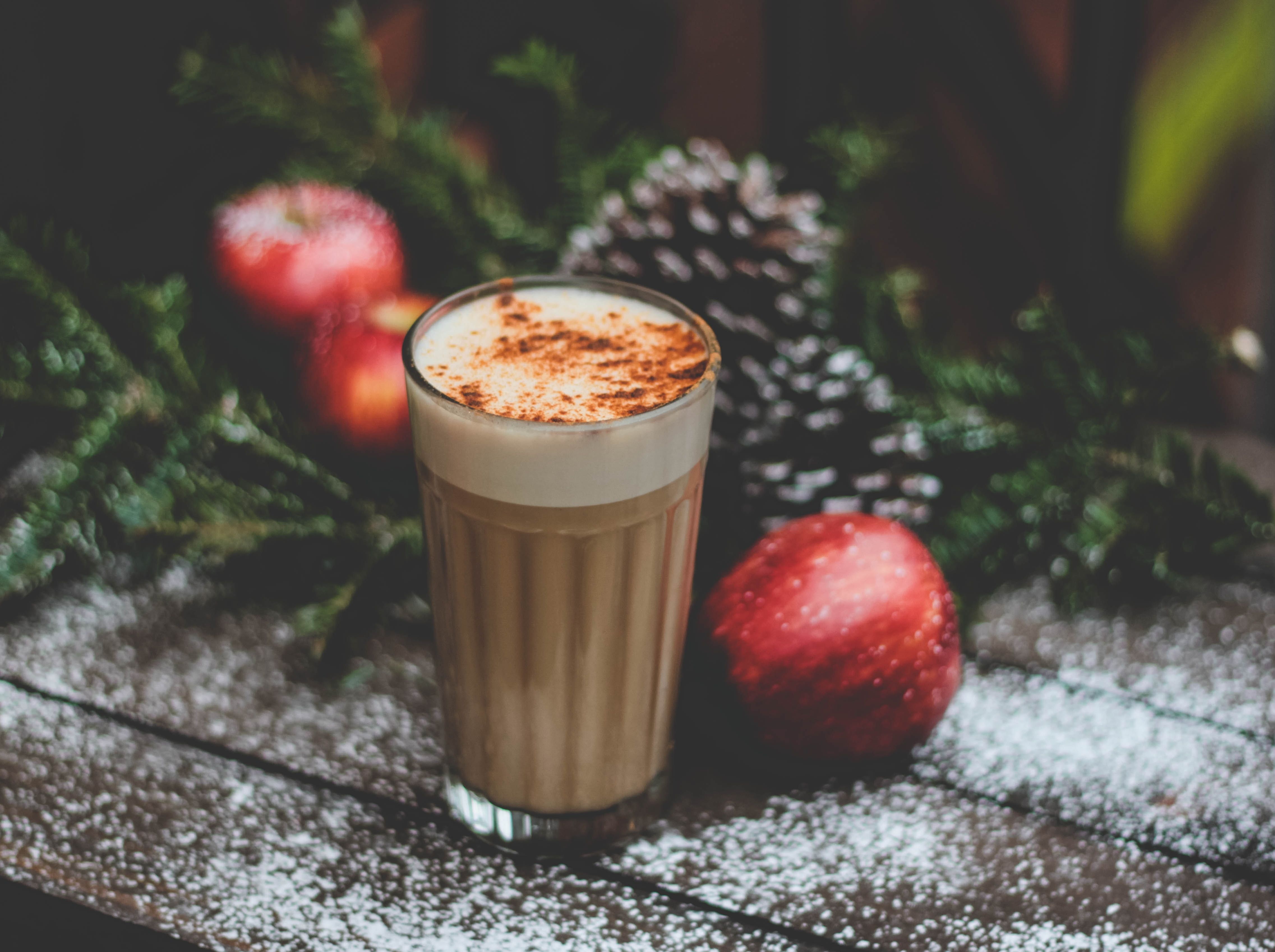 Spiced apple drink with festive background