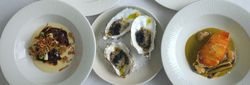 Five gourmet dishes beautifully plated on white dishes, including oysters, fish, and various entrees.