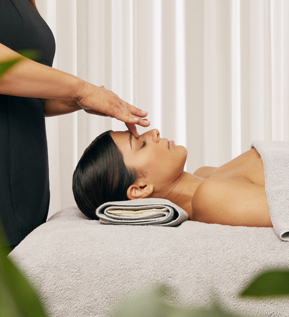 Person receiving a relaxing facial massage at a spa