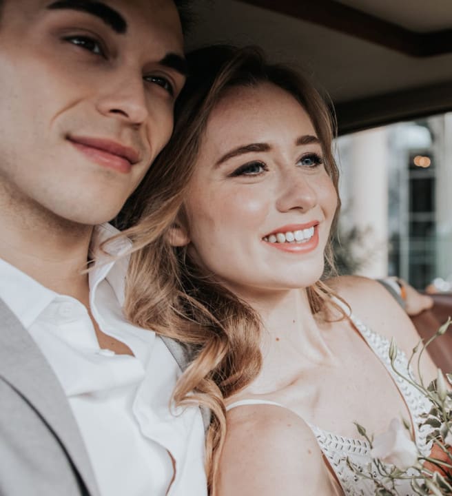 Bride and groom in car